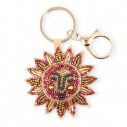 Llavero sol con rostro Dorado-dorado viejo-rosa AB