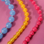 Dise&ntilde;a joyas llamativas con abalorios acr&iacute;licos DQ&reg; redondos